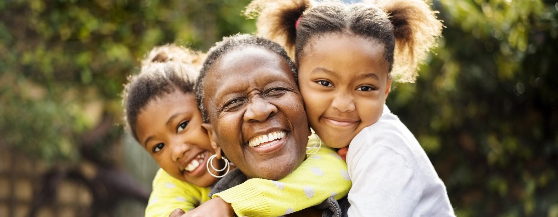 a person holding two children