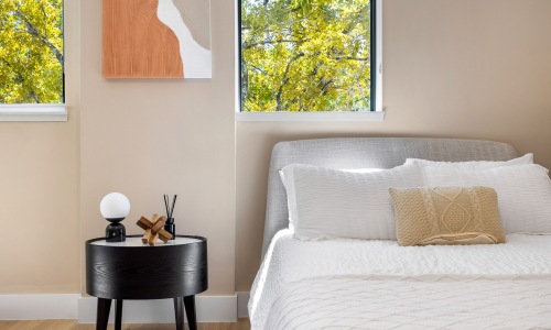 a bedroom with a bed and a nightstand