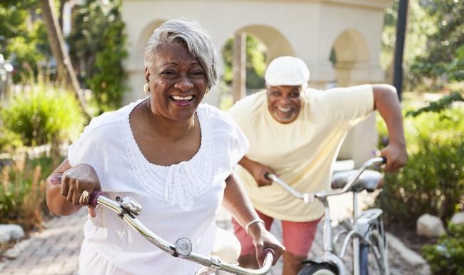 a man and woman riding bikes