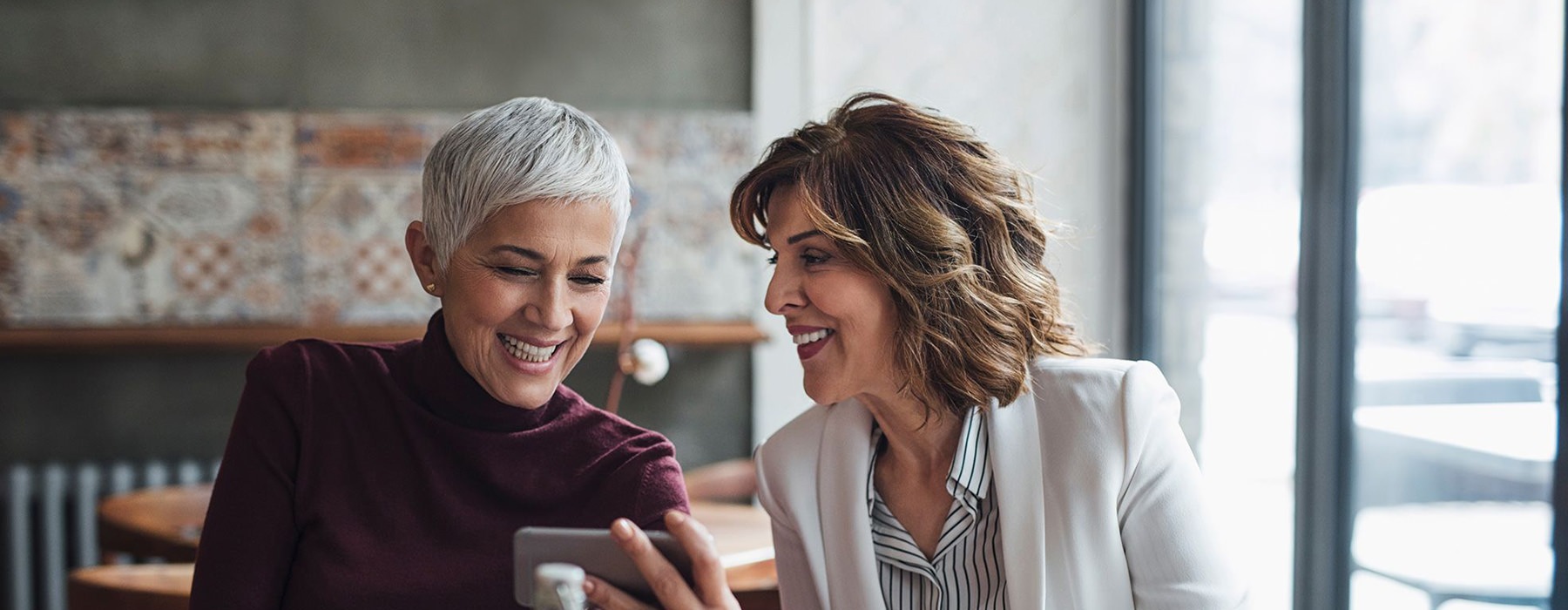 two woman on phone