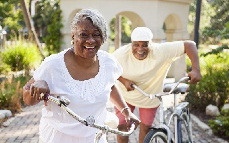 a man and woman riding bikes